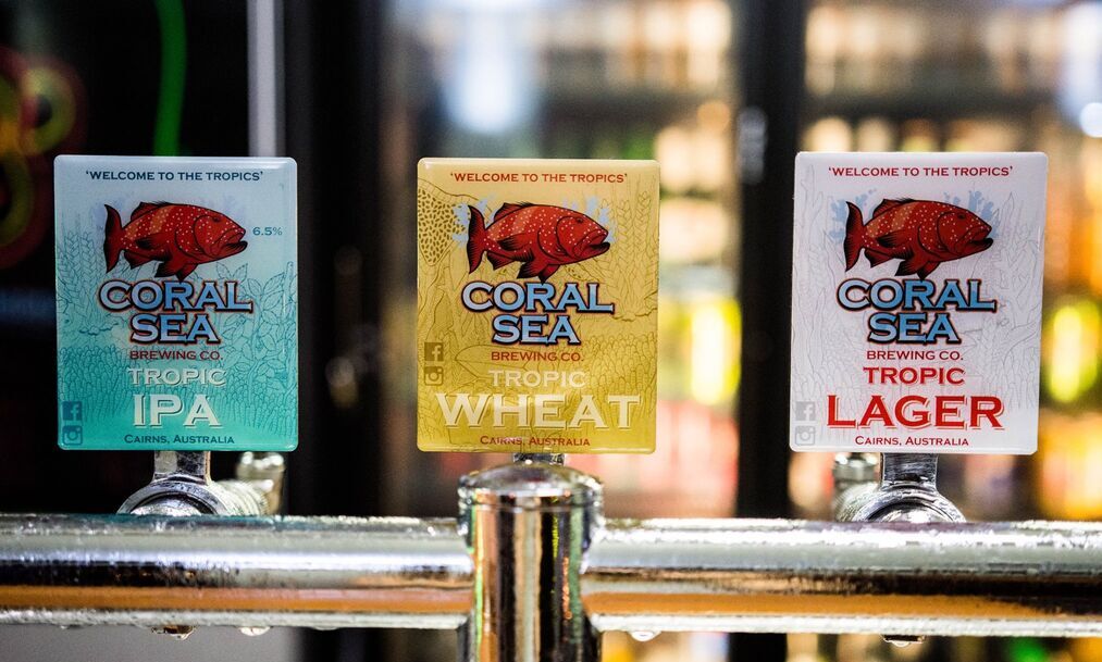 A close-up shot of three Coral Sea tap labels