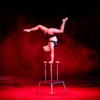 A girl performing acrobatics in the Lennon Bros Circus