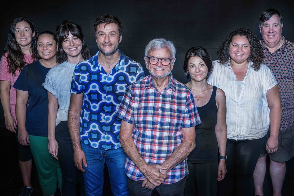 A group shot of the cast with Frank in the centre