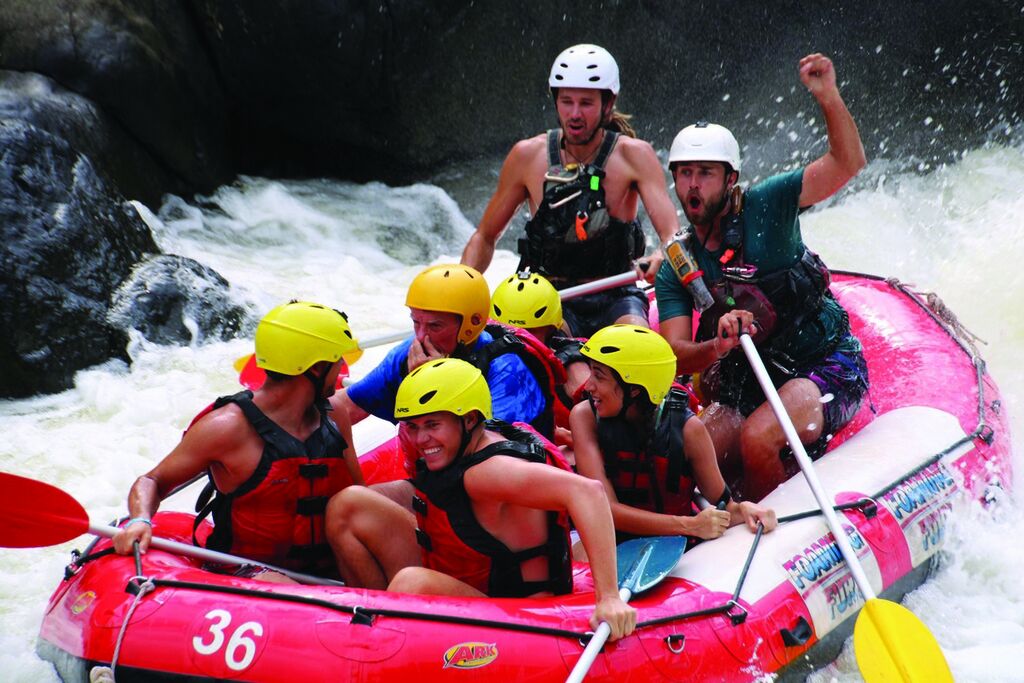 A group of people white water rafting 