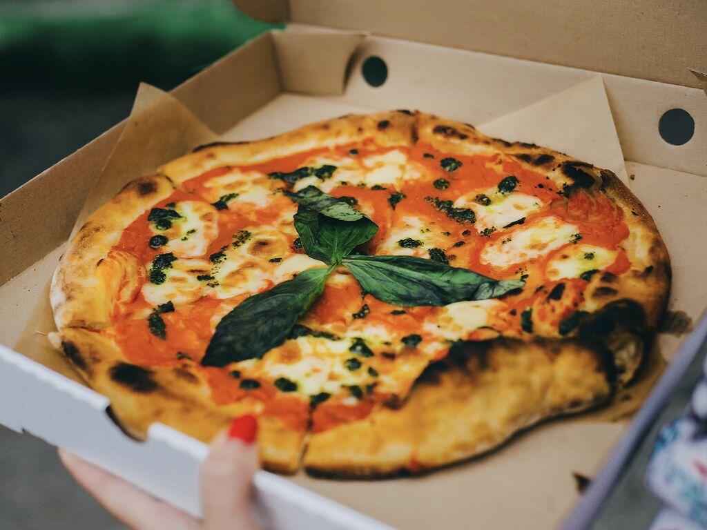 Close-up of a margarita pizza in a box